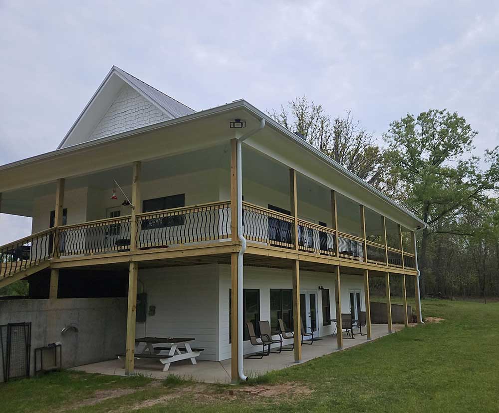 two story home with gutters installed